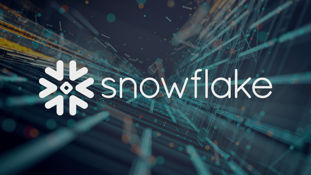 Snowflake logo against abstract background